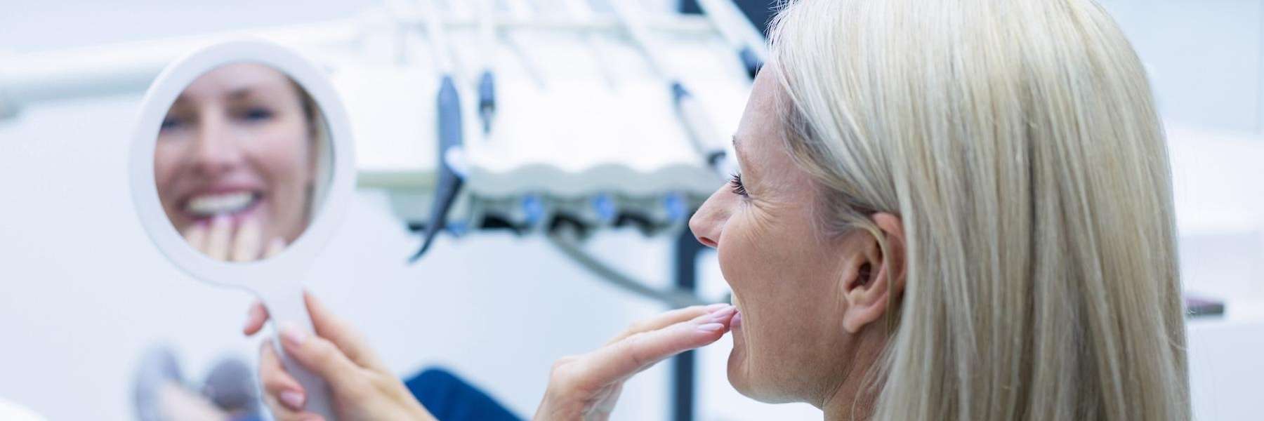 woman after getting her new dental implant in burke va